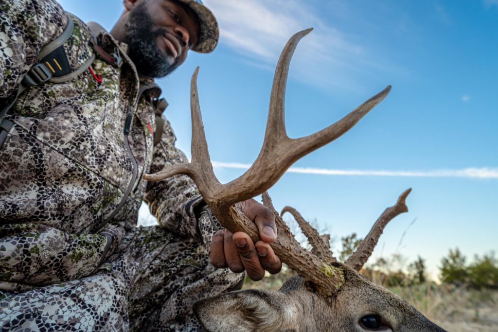 Warrior Denzel J. Washington with his buck on Cole Creek Ranch. Photo by Michael Herne/Coffee or Die.