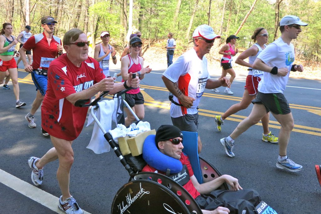 Dick Hoyt pushes his son Rick at a race in Wellesley, Mass.