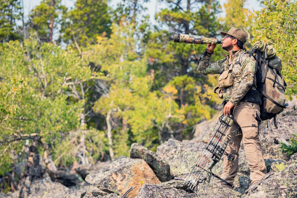 a bowhunter bugling for elk