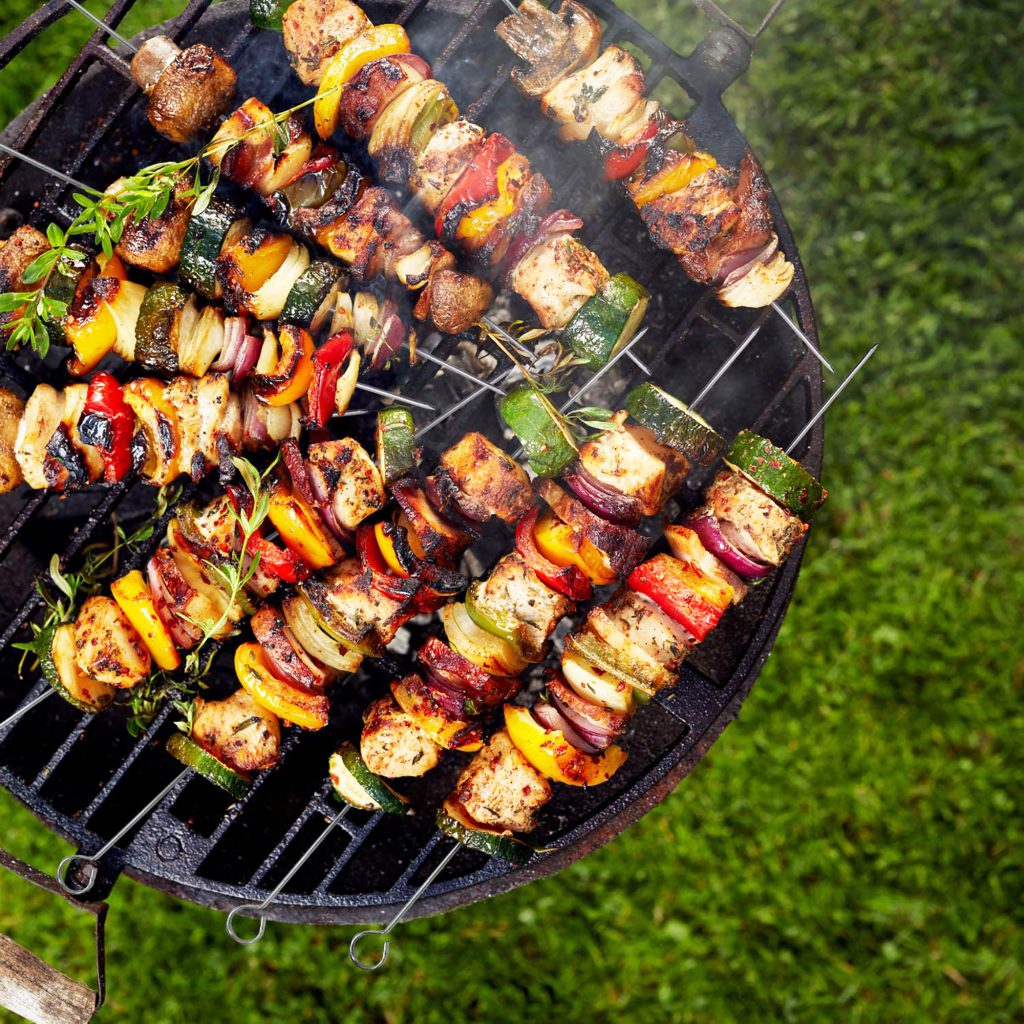 meat and vegetables on metal skewers most useful barbecue tools