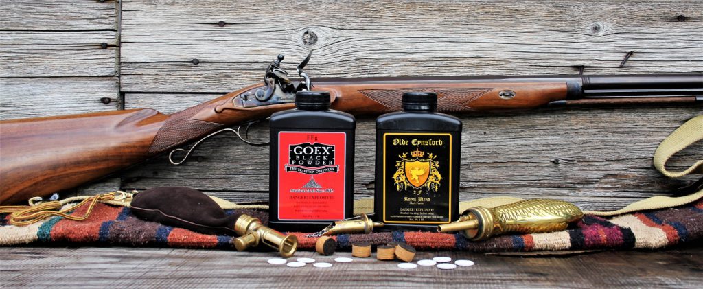 black powder rifle and cans
