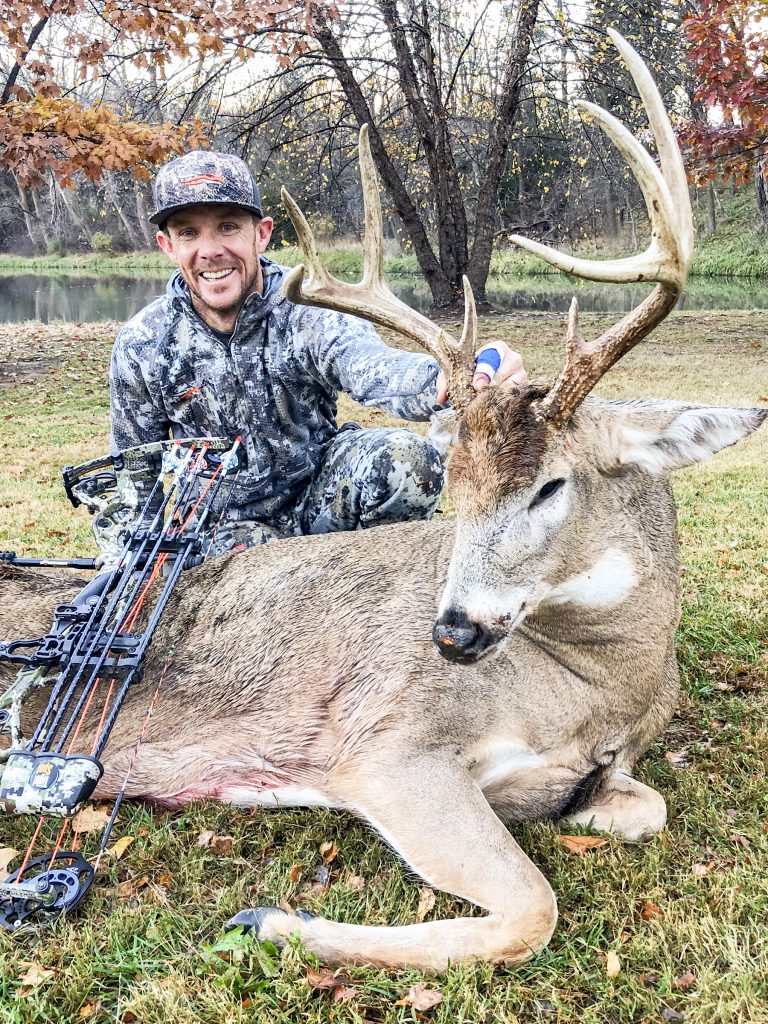 bowhunter with whitetail buck in nebraska