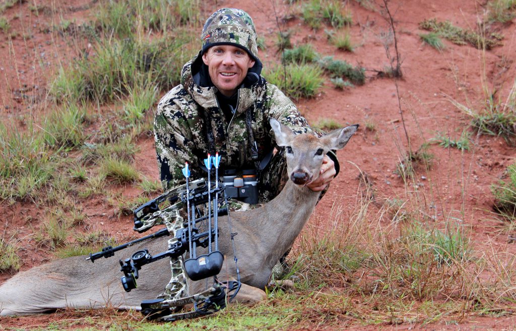 bowhunter with whitetail doe in oklahoma