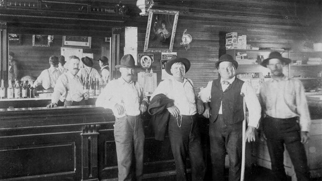 men standing at bar tombstone arizona
